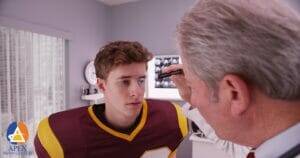 Doctor preforming a test on a patient for traumatic brain injury & concussions.