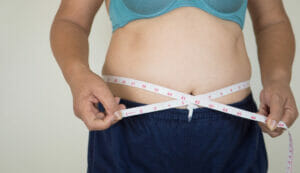 Woman Measuring Belly Fat